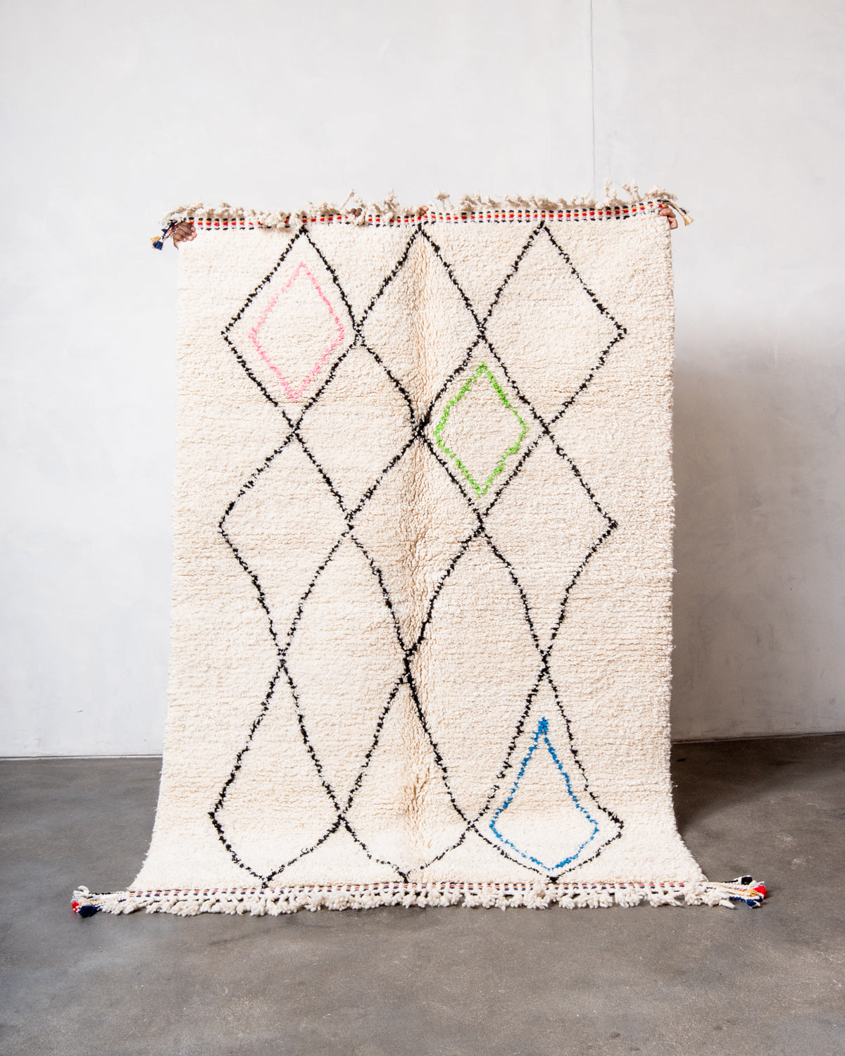 Modern, designer, handcrafted Berber rug from Morocco. Beniourain carpet with beautiful colours and patterns and fluffy wool texture.